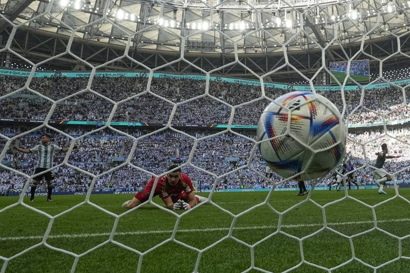 Argentina's goalkeeper Emiliano Martinez looks at the ball into the net after Saudi Arabia's Salem Al-Dawsari scored his side's second goal during the World Cup group C soccer match between Argentina and Saudi Arabia at the Lusail Stadium in Lusail, Qatar, Tuesday, Nov. 22, 2022. (AP Photo/Ricardo Mazalan)