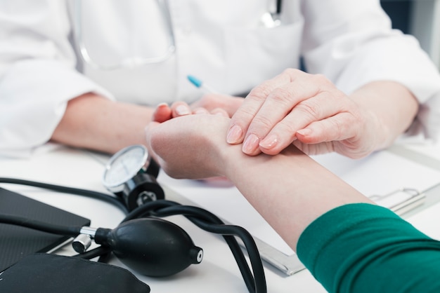 Doctor's hand tending to a patient