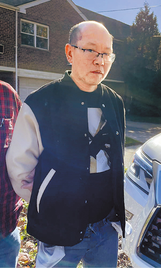 江峰24日在纽约市被捕 江峰24日在纽约市被捕