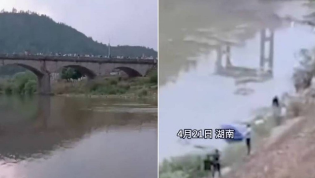 搜救人员在河边找寻落水者。 搜救人员在河边找寻落水者。