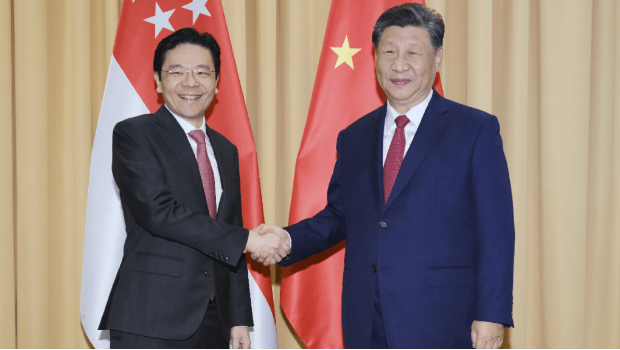 习近平去年在秘鲁会见黄循财。新华社 习近平去年在秘鲁会见黄循财。新华社